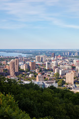 Fototapeta na wymiar Montreal city skyline view from Mount Royal on a sunny summer afternoon in Quebec, Canada