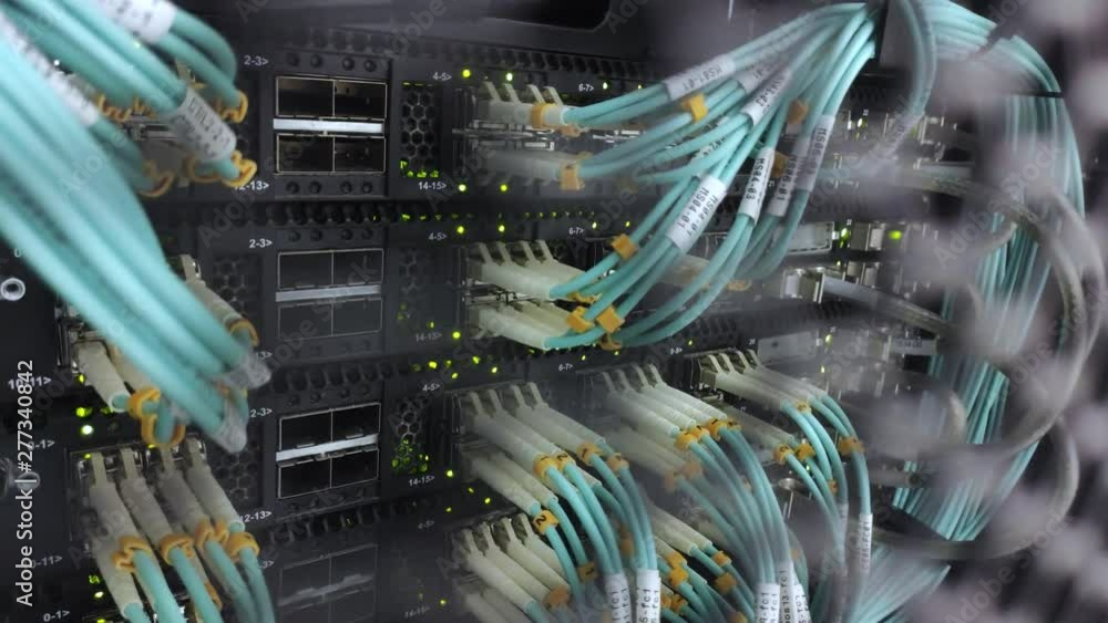 Poster row of server racks. working modern server. green led blink. video contains noise