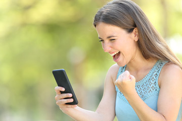 Girl finding exciting online content on smart phone