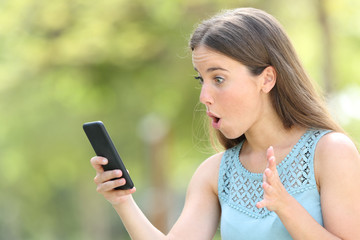 Girl finding surprising online content on smart phone