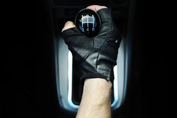 Gear lever. Manual Transmission. Hand on the gear shift in a car.