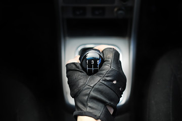 Gear lever. Manual Transmission. Hand on the gear shift in a car.