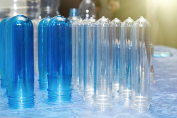 A closeup of several blanks for the production of plastic bottles