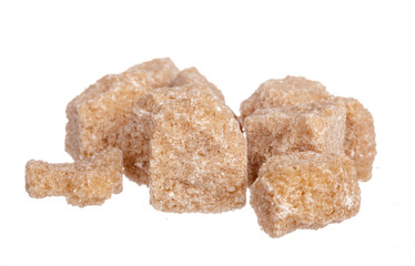 Brown cane sugar cubes isolated on white background