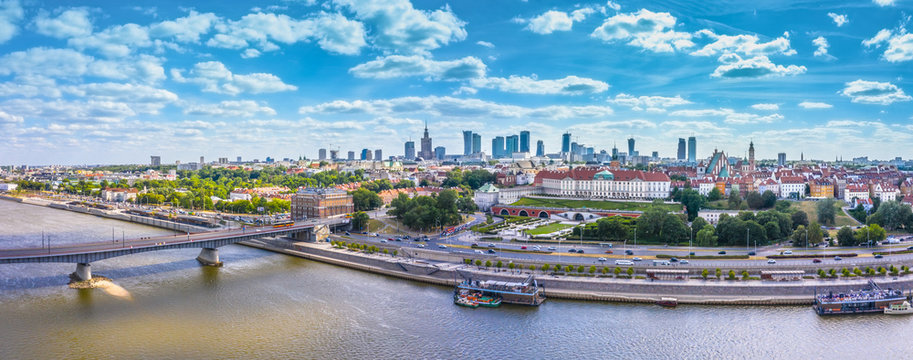 Fototapeta City skyline background. Aerial view of Warsaw capital city of Poland. From above, city view with night sky. Panorama of Warsaw cityscape. Europe. Aerial view