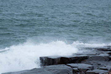 Waves of Lake Superior crashing on rocky shore