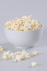White ceramic bowl filled with popcorn