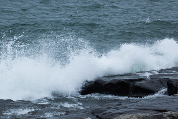 Waves of Lake Superior crashing on rocky shore