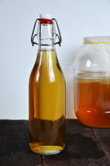 fermented drink, jun tea healthy natural probiotic in a glass jar.