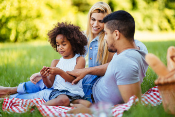 Fototapeta premium Happy family having fun time on picnic
