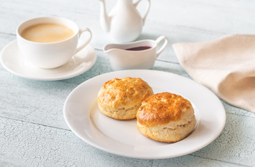Classic scones with cream and berry jam