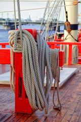 Close up of a rope on a old wooden ship. Details deck of the saiilboat