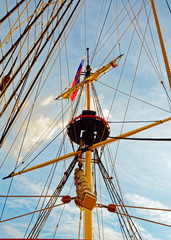 Masts and rigging of an old wooden sailboat. Details deck of the ship.