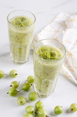 Two glasses of gooseberry smoothie.Healthy and fruity breakfast