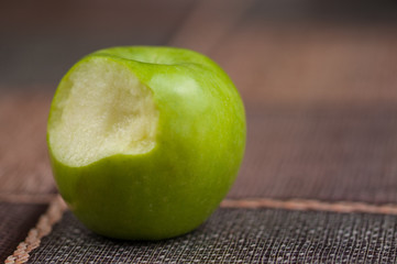 Beautiful green apple on the kitchen table.Green fruit