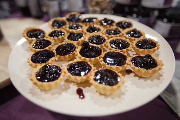 Mini tarts filling with organic aronia jam