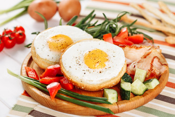 Fried Egg In Hole Toast Vegetable Mix Ham Slices. Spicy Prosciutto Greenery Salad Spring Onion Wooden Board. Sunny- Side Up Platter Healthy Food Closeup Cherry Tomato Rosemary Bunch Closeup Flat Lay