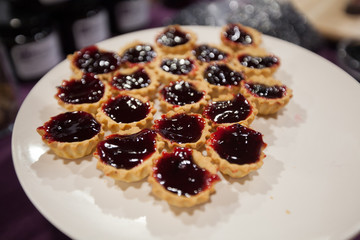 Mini tarts filling with organic aronia jam