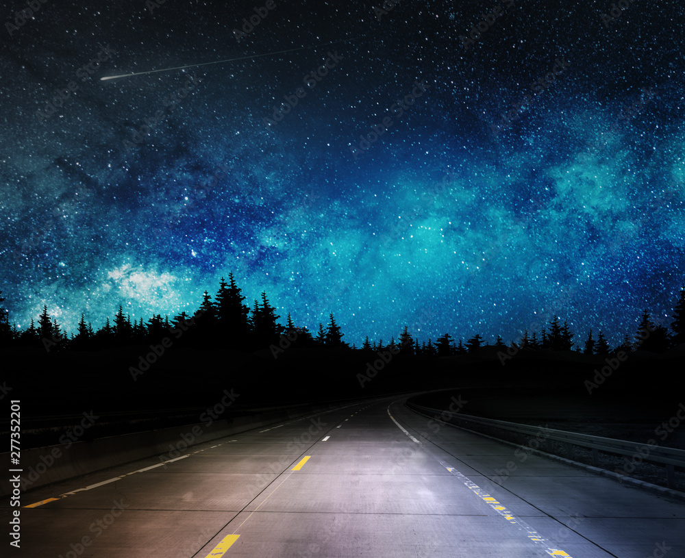 Wall mural dark night road through forest and starry sky