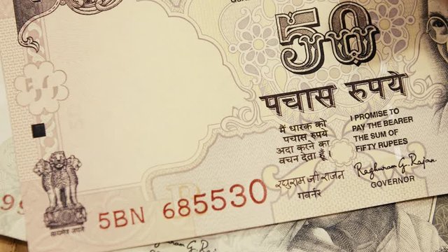 Indian Rupees paper banknotes being counted. The Gandhi Series of banknotes issued by the Reserve Bank of India (RBI) extreme close up shot
