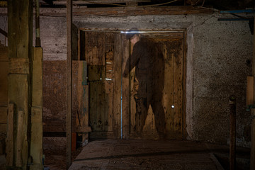 ghost in a barn opening a door