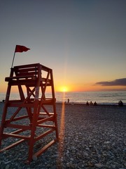 lifeguard tower at sunset