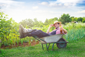 Young farmer resting in trolley