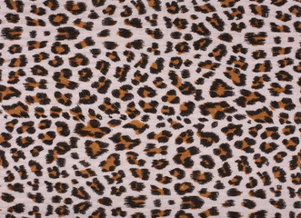 Cotton fabric with animal print. Animal pattern background or texture. Texture leopard.