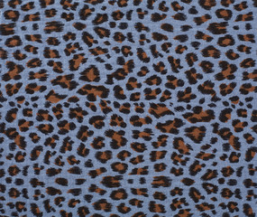 Cotton fabric with animal print. Animal pattern background or texture. Texture leopard.