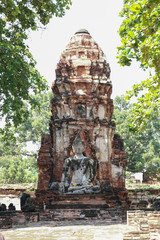 old ruins pagoda of Ayuttaya and buddha in public temple in historical park