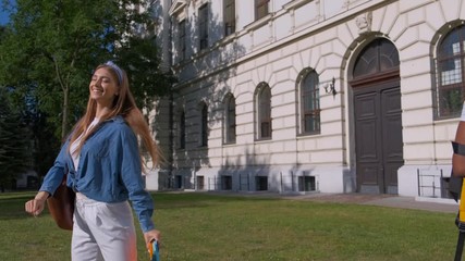 girls students say goodbye near the school. Friendship concept of students