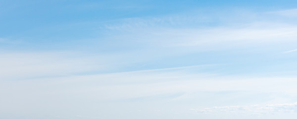 Blue sky with windy cirrus clouds at daytime