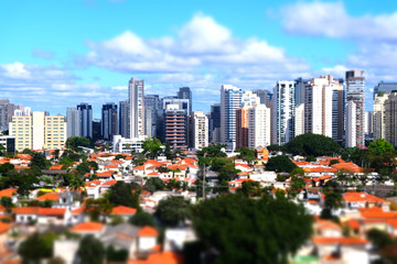 Fototapeta na wymiar Miniature rooftop view of downtown skyscraper buildings by tilt-shift in Sao Paulo Brazil