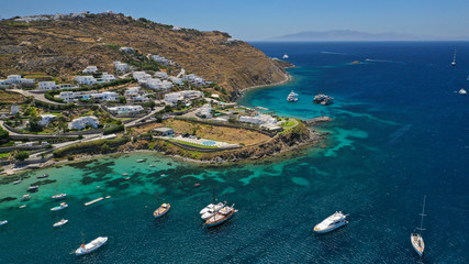 Aerial drone photo of paradise celebrity bay of Ornos famous for pool resorts and sandy turquoise organised clear sea beach, Mykonos island, Cyclades, Greece