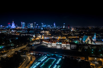 Fototapeta na wymiar Great panoramic night view of the center and the Old City of Warsaw - Stare Miasto - from the right bank of the Vistula River. Palace of Culture City center. Aerial