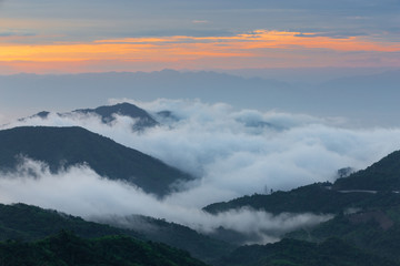 Mountain view on the morning with sea of fog and sunrise light.