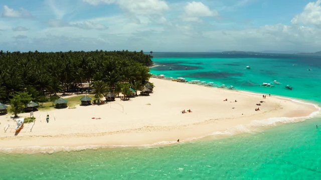 Tropical landscape: Daco island with beautiful beach, palm trees by turquoise water view from above. Siargao, Philippines. Summer and travel vacation concept