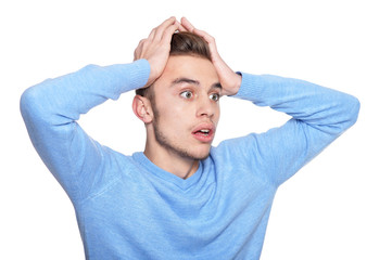 Portrait of handsome surprised man posing isolated