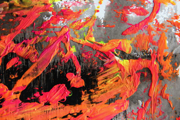 Splashes and smears of colored paint paints on black background