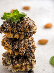 Useful homemade almond cake with coconut chips on a light background, copy space