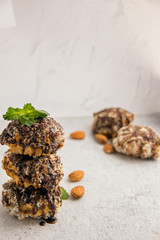 Useful homemade almond cake with coconut chips on a light background, copy space