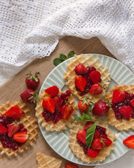 Viennese waffles with strawberries on a gray background. food photography . Flat gasket. Flatley