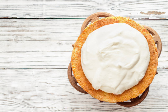 Victoria Sponge Cake With Whipped Cream Over A White Wooden Rustic Table Top. Image Shot For Above.