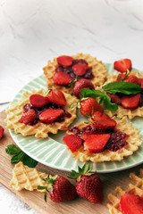 Viennese waffles with strawberries on a gray background. food photography