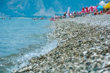 Konyaaalti beach in Antalya, Turkey, blue mediterranean sea, sunny weather. Travel and vacation at the resort