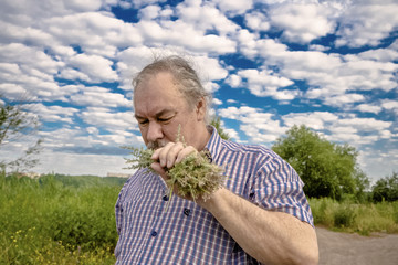 A man while collecting herbs