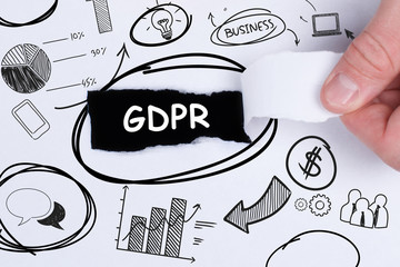 Business, technology, internet and networking concept. Young entrepreneur showing keyword: GDPR