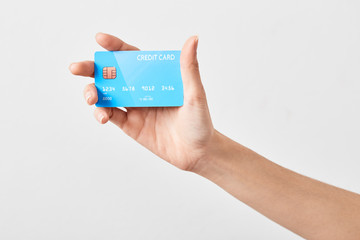 Credit card in hand on white