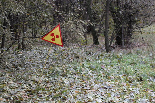 Radiation sign on a graveyard in abandoned Pripyat city in Chernobyl Exclusion Zone, Ukraine