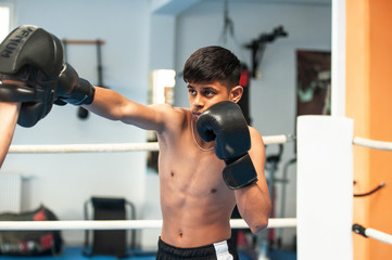 Indian young trained boxing in the gym